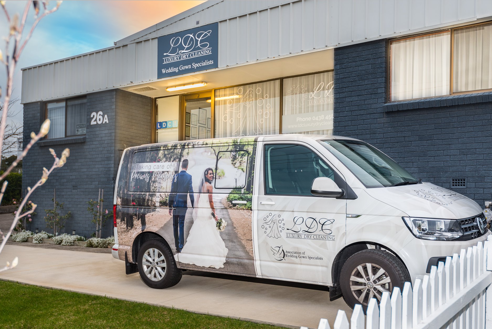 front view of LDC Luxury Dry Cleaning building with van 
